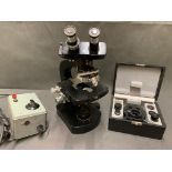 A vintage electric Wild of Switzerland scientific microscope