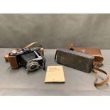 2 antique kodak cameras in leather cases