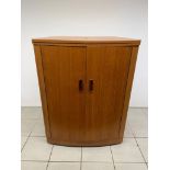A Turnidge of London mid century fold out bar cabinet, in good condition,