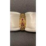 A 15 carat yellow gold ring set with ruby and other stones, size Q, 3 grams
