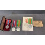 A collection of 4 mixed George V service medals