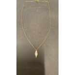 An 18 Carat yellow gold chain and pendant set with 3 diamonds