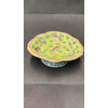 A Chinese yellow ground footed dish with bat and peach decoration. Six character mark 19th century