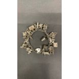 A silver charm bracelet, 83.7 grams