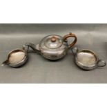 An Art Deco silver plated tea pot, cream jug and sugar bowl