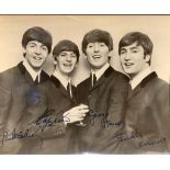 A printed Beatles Photograph of the Fab Four, autographs are printed on Given to the seller's