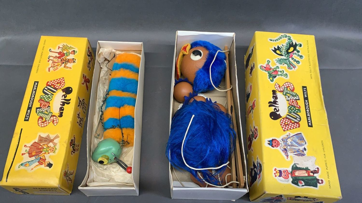 2 boxed Pelham Puppets - Emu and Caterpillar