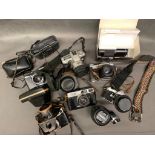 A box containing 6 SLR cameras and lenses