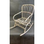 A small vintage cane child's rocking chair