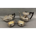 A silver tea pot and coffee pot with matching creamer and sugar bowl, 1868 grams in total Tea