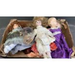 A collection of vintage plastic and china dolls