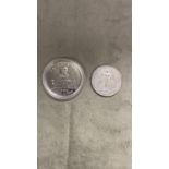 2 silver coins a Chinese silver dollar 21.1 g and a commemorative silver coin celebrating Hong