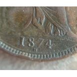 A Heaton mint 1874 bun head penny