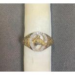 A 9 carat gold gentlemen's ring set with 14 small diamonds with a horse head face, 6.3 grams, size