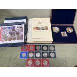 A folder containing 16 first day coin covers celebrating QE2 80th birthday, a first day coin cover