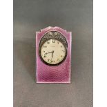An Edwardian shaped arched rectangular easel boudoir timepiece. 4cm silver dial inscribed with