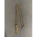 A 9 carat gold ingot pendant and chain, 7.7 grams, never worn