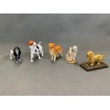 Five dog figurines, two Beswick, one Chelsea Poodle with gold anchor mark, one cast metal, one