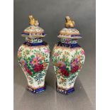 Two small antique vases with chrysanthemum decoration, 21cm high