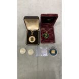 2 enamel necklace coins along with 2 1995 Â£2 coins a Battle of Britain 50p and a Gibraltar 1967