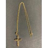 A 9 carat gold cross pendant and chain, 8.25 grams, never worn