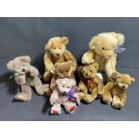 A collection of 7 small jointed bears