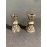 Two Thai silver candlesticks with weighted bottoms, 500 grams