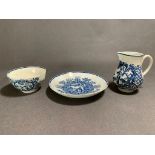 Possibly late 18th century small milk Jug, sugar bowl and saucer with blue and white decoration