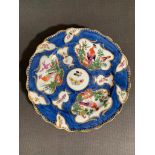 An eighteenth century Royal Worcester plate, heavily decorated with a deep blue ground