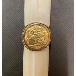 A 1906 half sovereign in 9 carat gold setting, total weight 8.6 grams