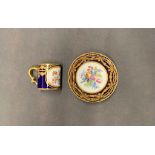 A Sevres in beau blue palette and gold cup and saucer with floral decoration, dates circa 1754 and