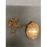 A 9 ct gold locket and chain 13 grams