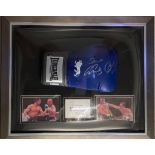 A signed boxing glove in dome frame, signed by Carl Froch and George Groves