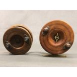 Two wooden centre pin ''Brass Strap Back'' reels, one with brass lined spool
