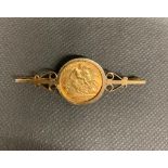 A 1911 half sovereign in 9ct gold broach setting total weight 7.08 grams