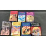 A collection of seven Harry Potter books Adult edition of The Order of The Phoenix, Hard back, first