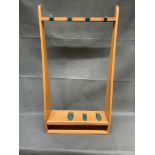 A vintage oak gun rack 93 cm high