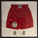 A pair of signed boxing shorts by Marco Antonio Barrera framed and glazed