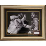A large photograph of Henry Cooper and Mohammad Ali with Henry cooper’s signature
