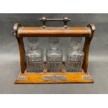 A three bottle crystal tantalus