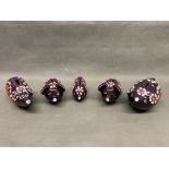A group of 5 purple Arthur wood piggy banks