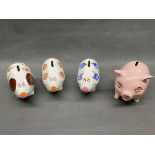 A collection of 4 Arthur wood pigs