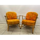 A pair of very good Ercol blonde Windsor chairs