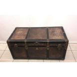 A vintage leather trunk with removable insert