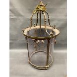 A large antique brass hall lantern 75cm high. ( glass replaced with plastic)