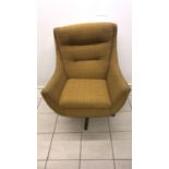 A mid century Parker Knoll swivel arm chair with original cover