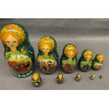 An exquisitely painted set of 10 Russian nesting dolls depicting medieval hunting scenes, hand