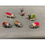 A group of 6 silver pin cushions 4 x pigs, a bear and a tortoise