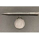 An antique silver propelling pencil along with a William lV silver coin in silver mount , 48 grams