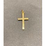 An 18 ct gold cross 3.2 grams